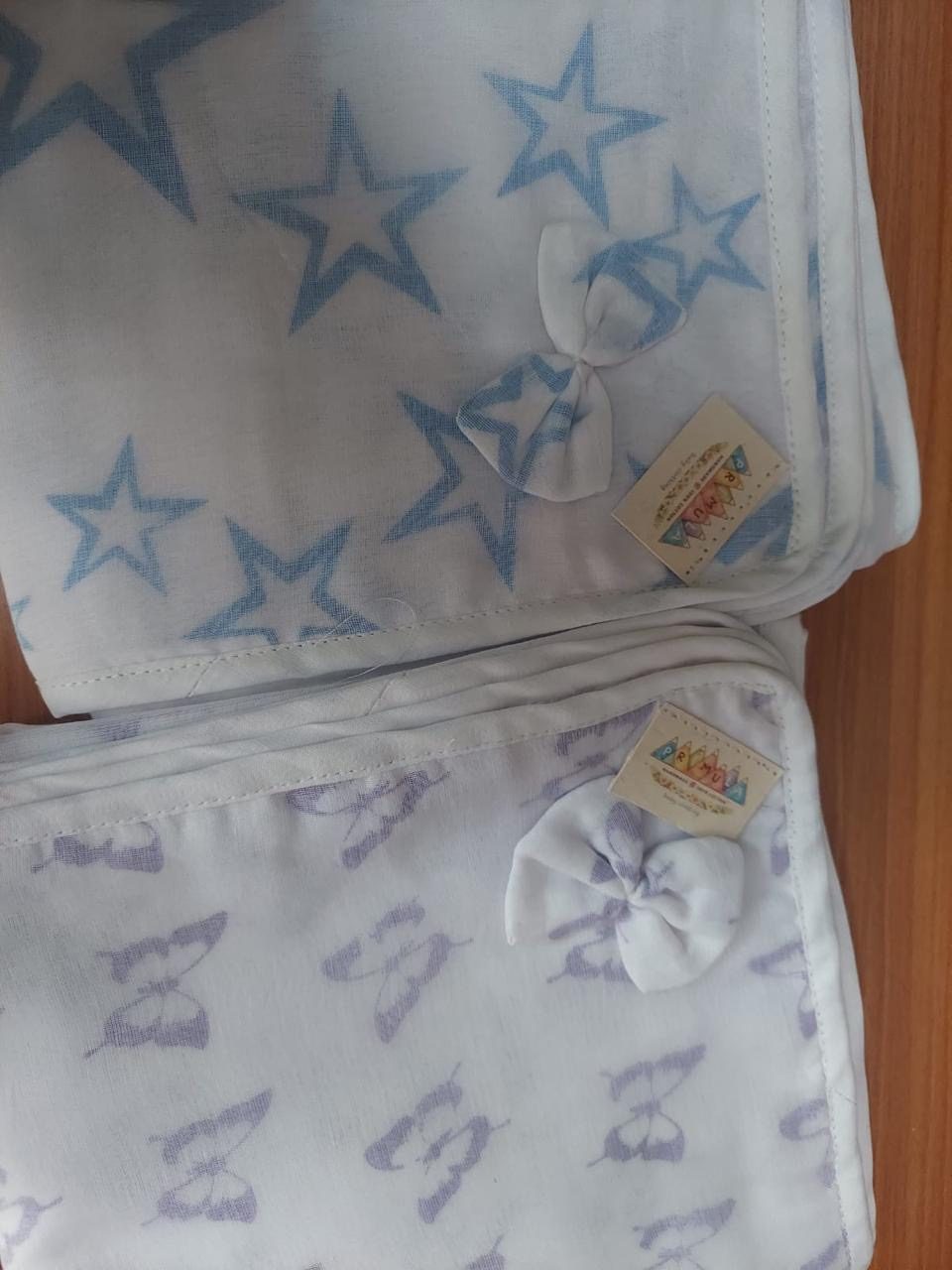 Primula muslins folded and tied with bows, ready to give